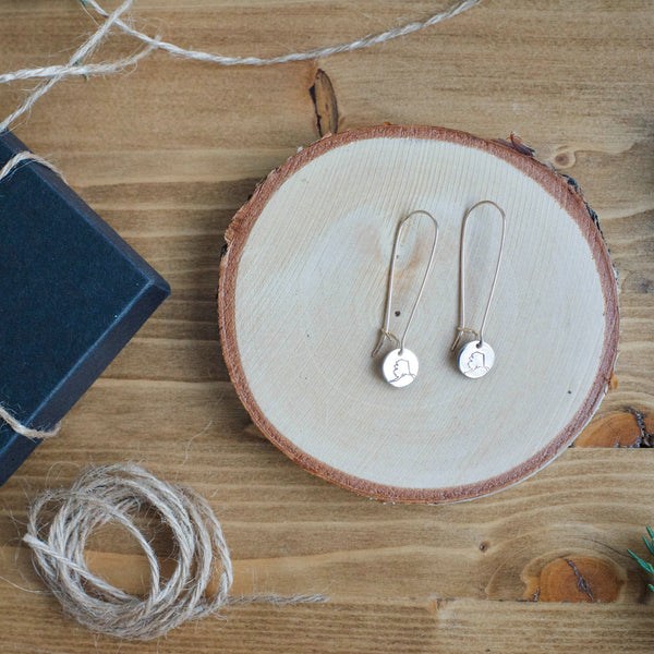 Delicate drop style earrings, hand-stamped with an outline of the state of Alaska